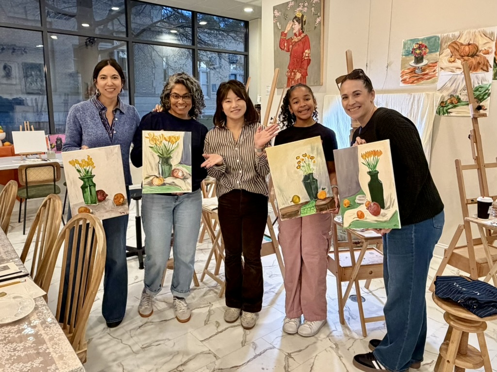 Guests enjoying a painting session at Muse & Co